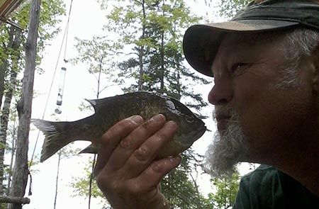 Jimmy kissing a fish