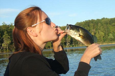 Mindy kissing a fish